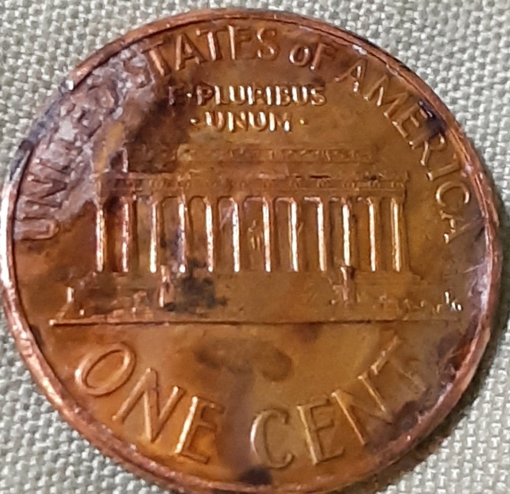 1987-Penny-With-Half-Of-The-Coin-Face-Missing-&-Just-Plain-Silver,-Error?