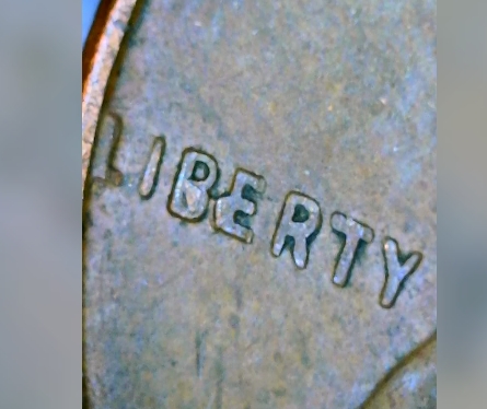 1957-D-1c-Liberty-Crooked-E