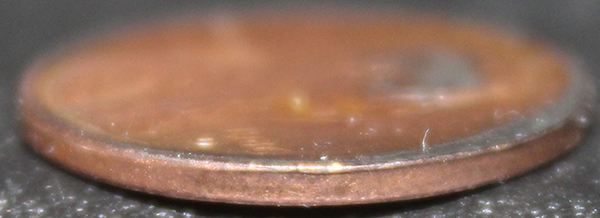 Two-80's-Lincoln-Cents.-Cut-Planchet?-Melted?