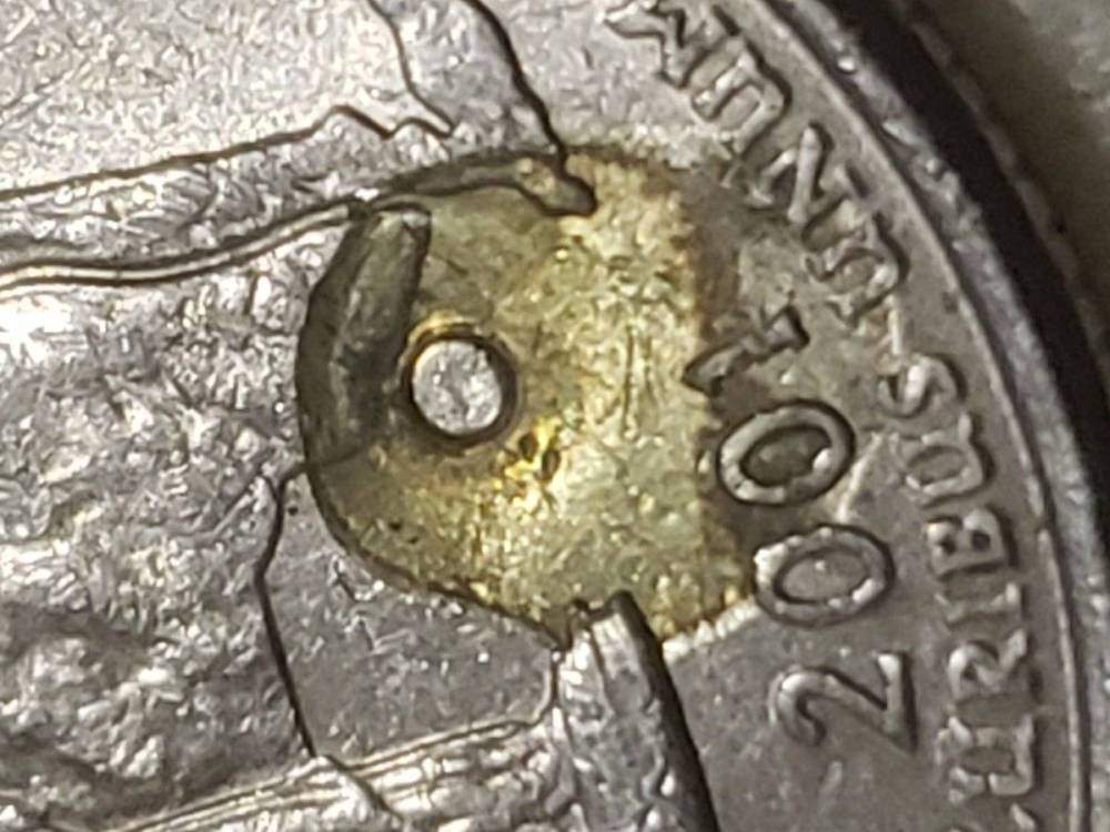 2001-NYC-Struck-Through-Plastic-With-Round-Eye-Center