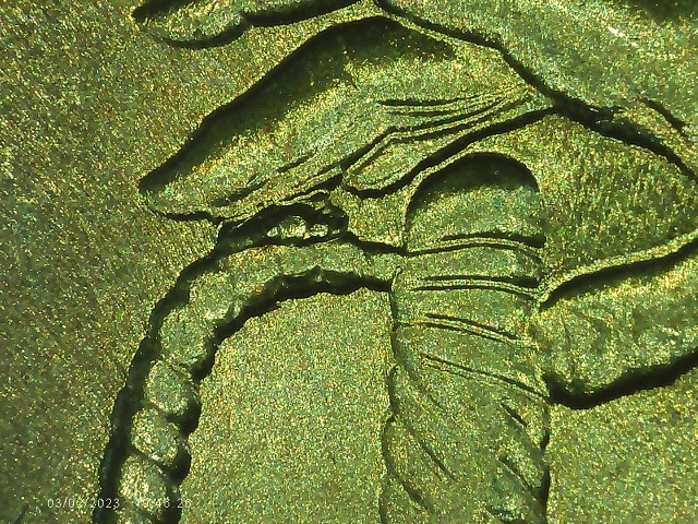 2015-Quarter-With-Die-Chip-Between-Finger-&-Sword-Handle