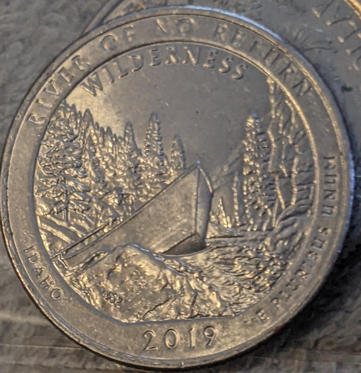 2019-Quarter-Looks-Like-Opposite-Edge-Clad-Layer-Folded-Over-The-Edge-Of-The-Coin-And-Was-Struck