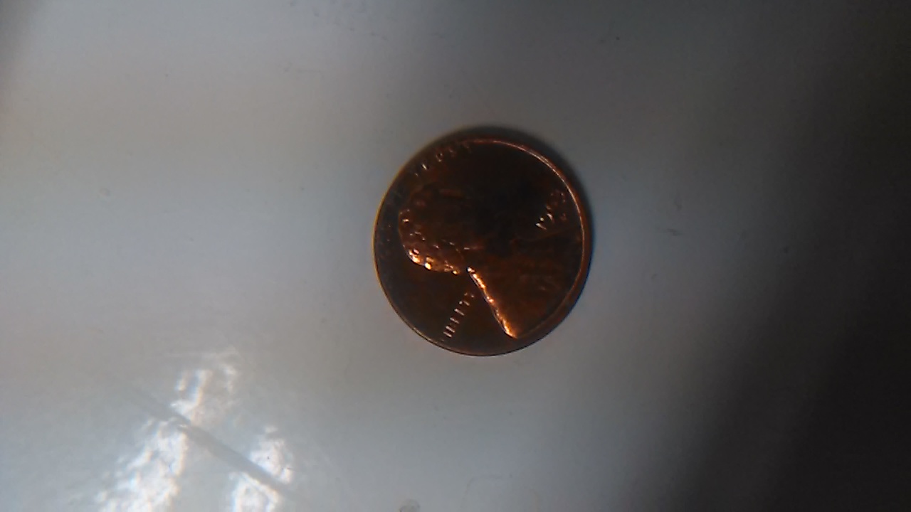 1963-D-Red-Penny-And-1977-Penny-Turn-Into-Black