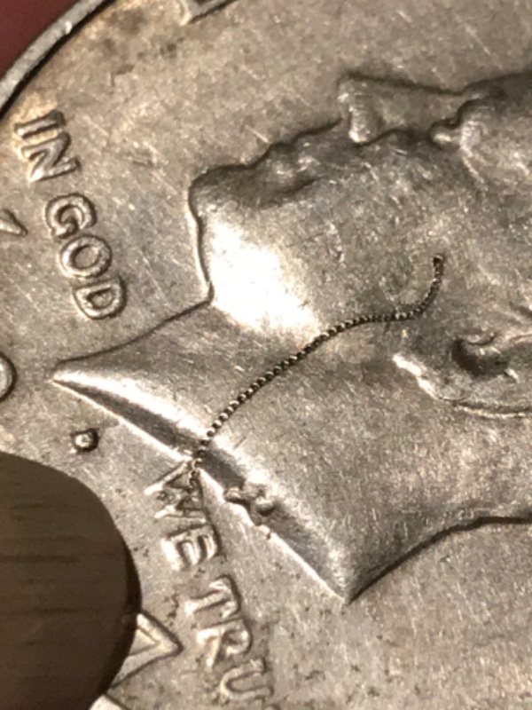 1977-Kennedy-Half-Dollar-With-Really-Cool-Struck-Through-Error-If-Not-I'm-Still-Keeping-It