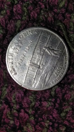 Hello,-Help-Needed,-2001-State-Quarter-With-Unknown-Surface-Metal-And-Rims