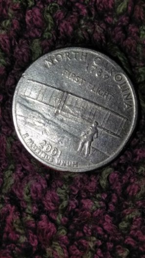 Hello,-Help-Needed,-2001-State-Quarter-With-Unknown-Surface-Metal-And-Rims