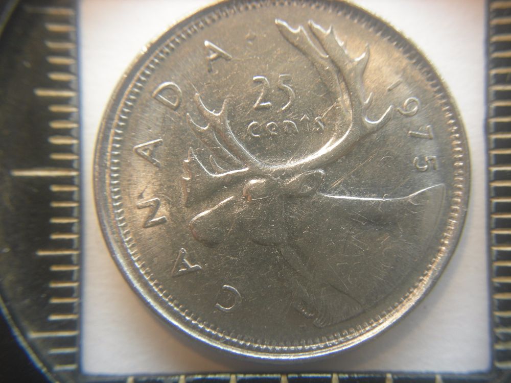 1975-Quarter-On-1966-5-Cents;-What?