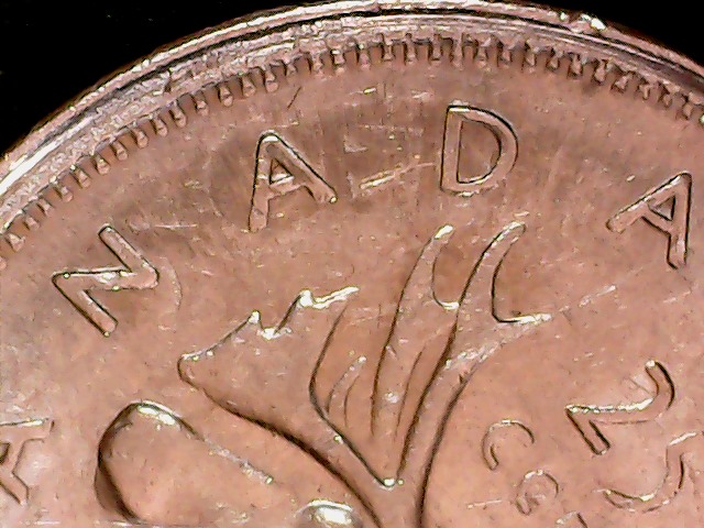 1975-Quarter-On-1966-5-Cents;-What?