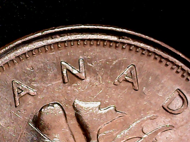 1975-Quarter-On-1966-5-Cents;-What?