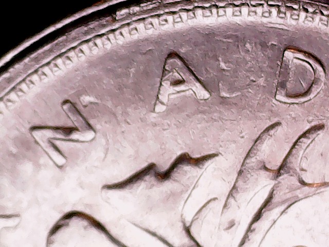 1975-Quarter-On-1966-5-Cents;-What?