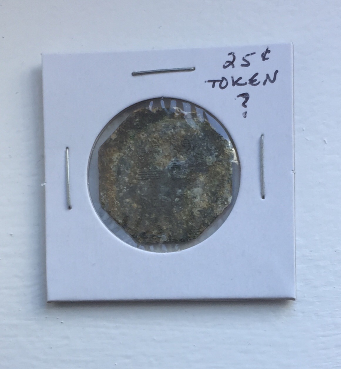 25-Cent-Token-Found-With-Metal-Detector.-Identification-Eludes-Me