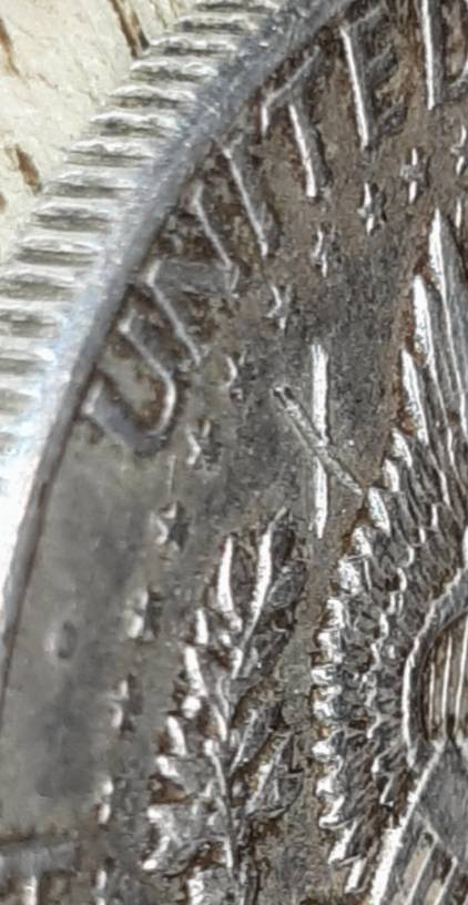 1964-Kennedy-Half-With-3-X-Shaped-Die-Crack-Marks-On-It