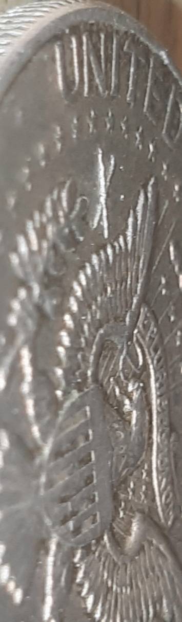 1964-Kennedy-Half-With-3-X-Shaped-Die-Crack-Marks-On-It