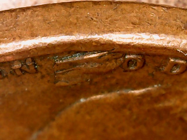 1957-D-LWC-Struck-Through-Debris-Or-Just-Lamination-Issue?