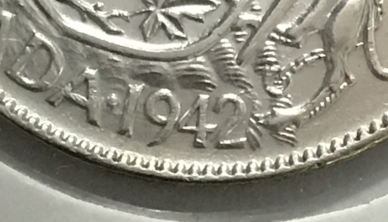 Difference-Between-A-Narrow-And-Wide-Date-On-The-1941/42-Fifty-Cent-Coin