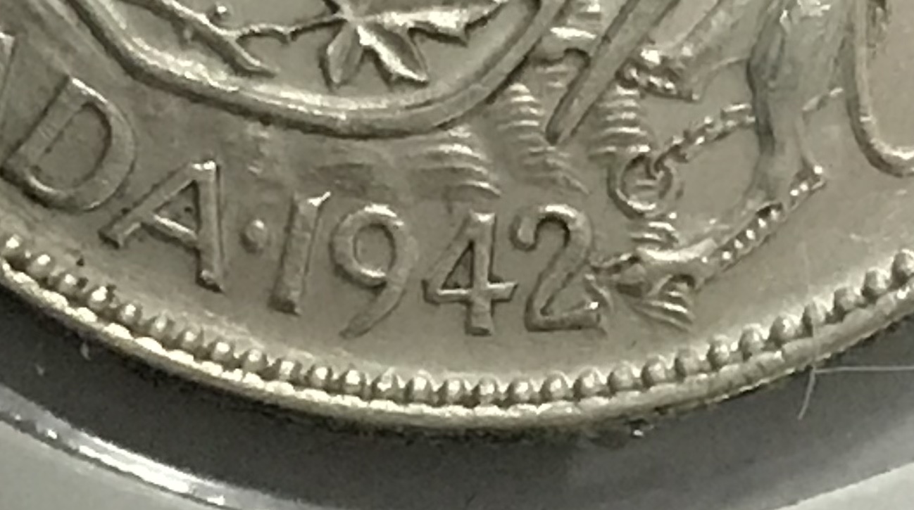 Difference-Between-A-Narrow-And-Wide-Date-On-The-1941/42-Fifty-Cent-Coin