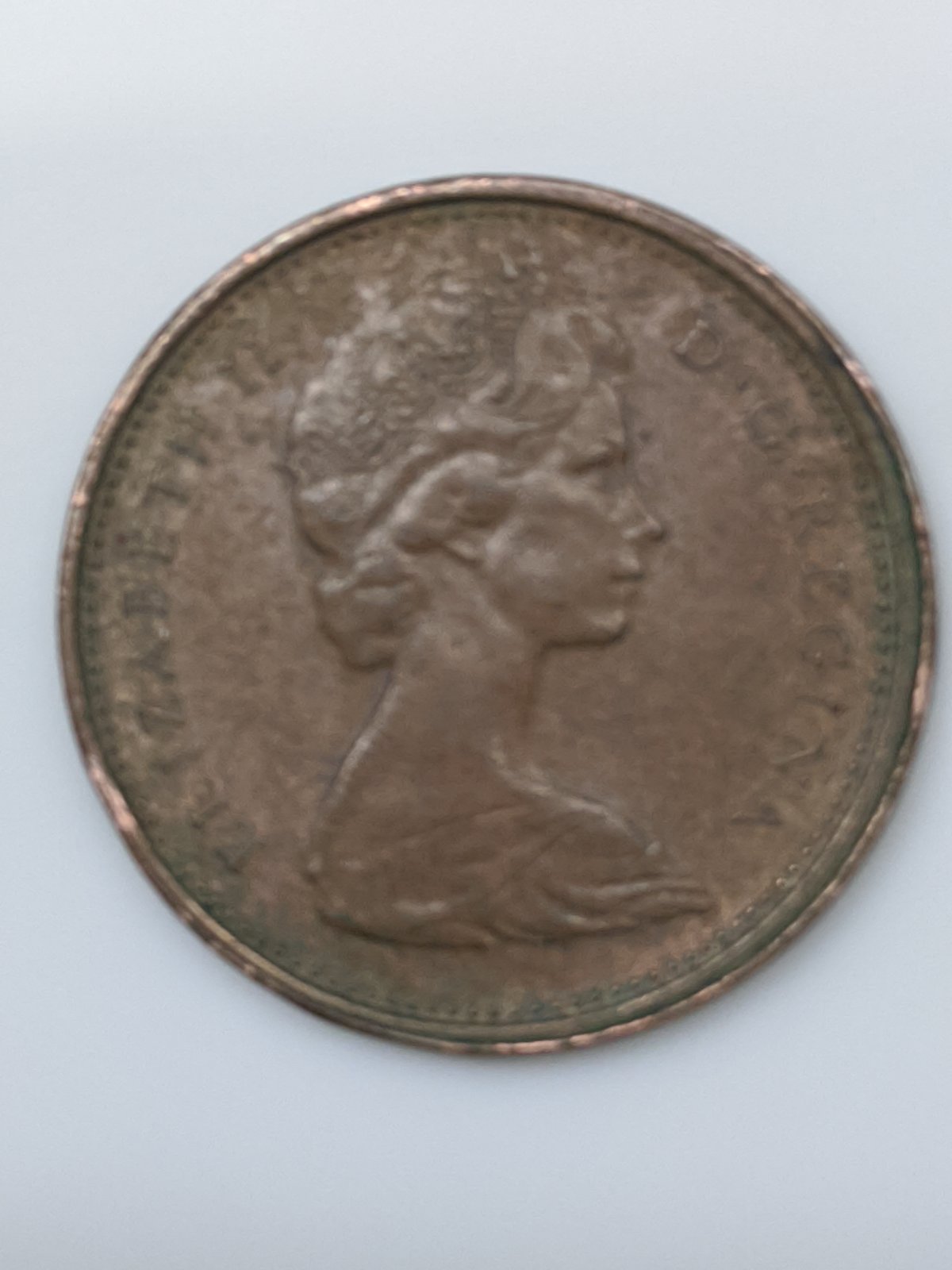 Is-The-A-Mad-Coin-With-A-Rim-Fin-On-1975-Penny.