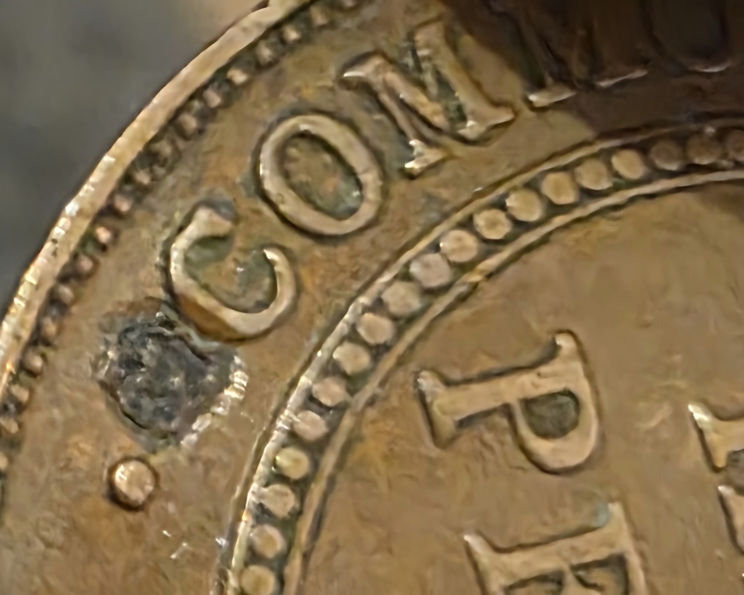 1934-Half-Penny-With-Something-Embedded?