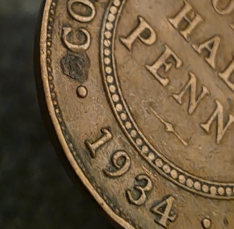 1934-Half-Penny-With-Something-Embedded?