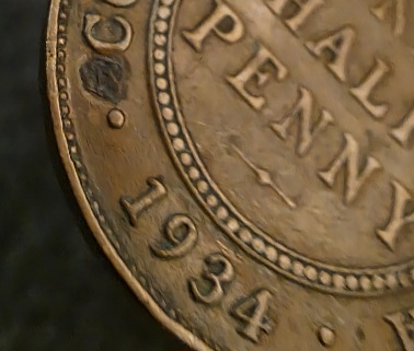 1934-Half-Penny-With-Something-Embedded?