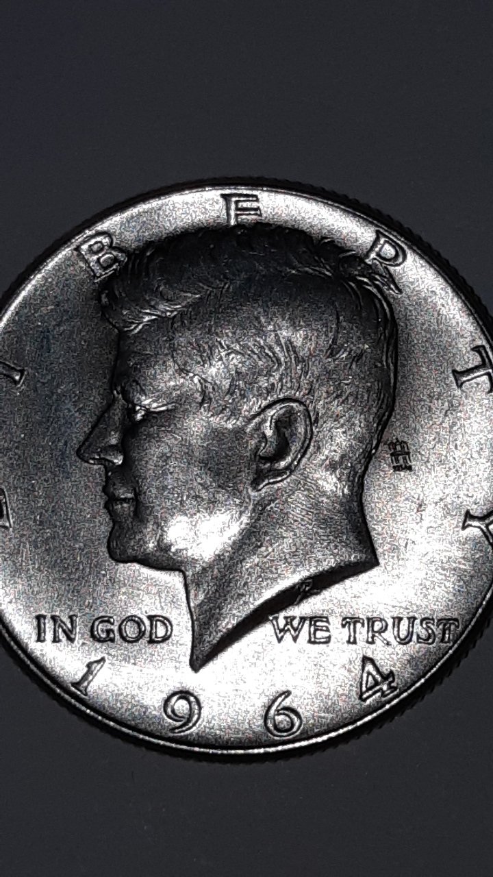 1964-Kennedy-Half-Dollar-With-A-Mark-Behind-The-Head