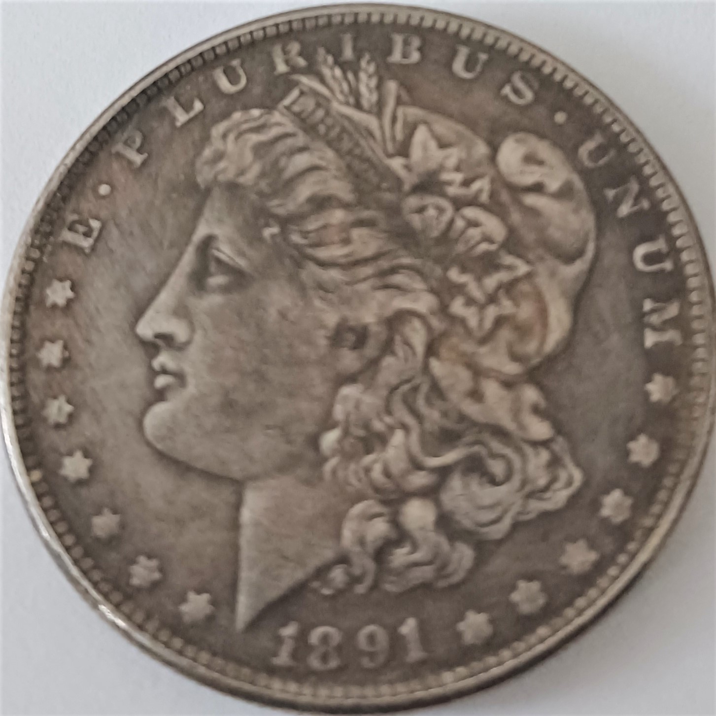 1891-CC-Morgan-Silver-Dollar.-The-Magnet--Stuck-To-It.