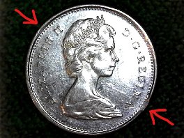 1967-Canadian-Bobcat-25c-Error,-Or-Damage?