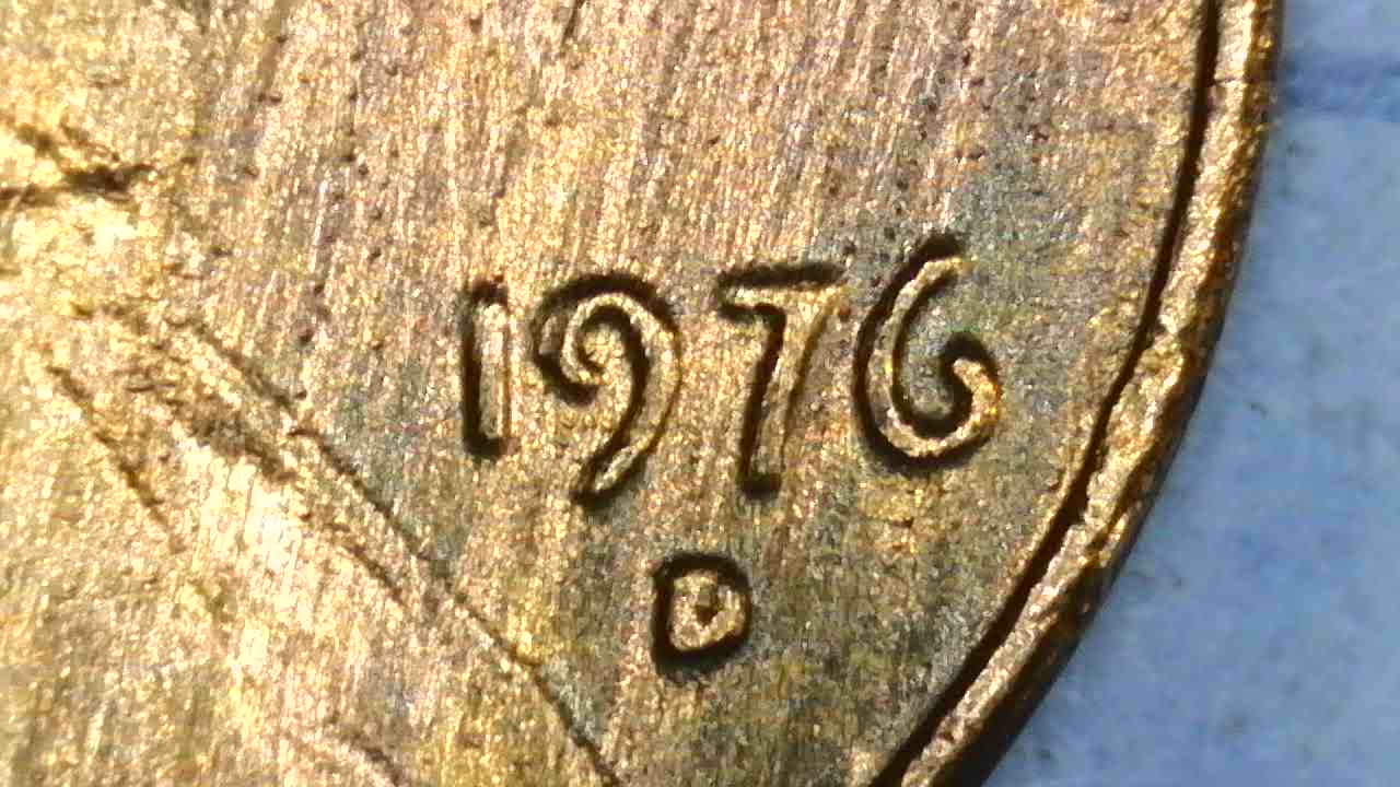 1976-D-Cent-What-Have-I-Found?--Bleb,-Occluded-Gas-Bubbles,-Flow-Lines,-Parallel-Lines?