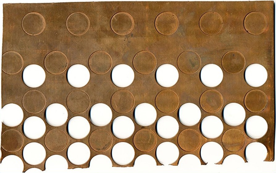 Examining-The-Lead-End-Of-A-Copper-Cent-Coinage-Strip