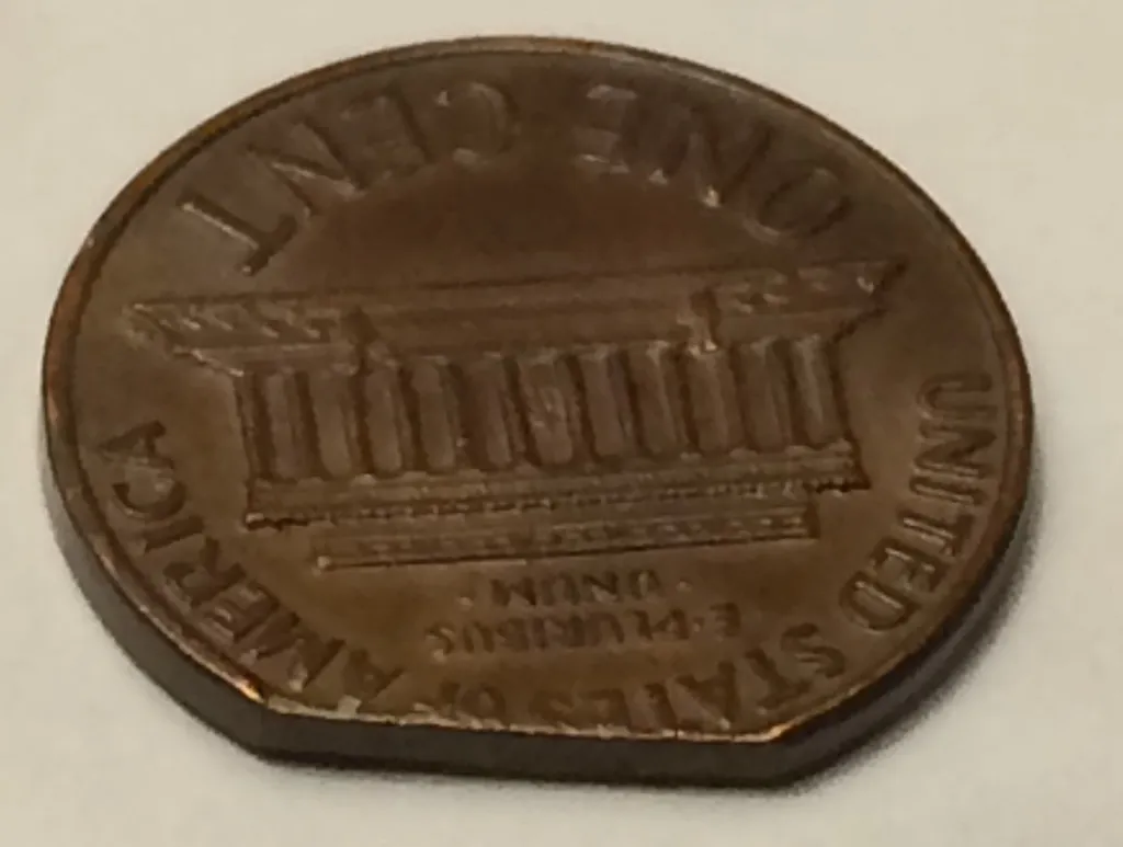 1969-Lincoln-Memorial-Cent---Clipped-Planchet-Or-PMD?