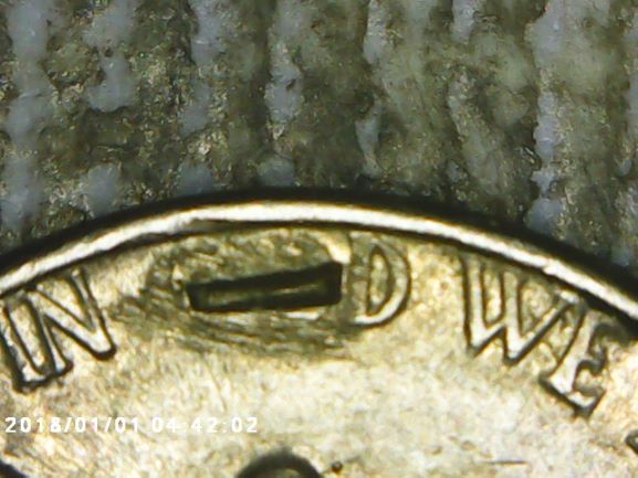 1965-Nickel-With-A-T-And-Something-Inside-Of-God