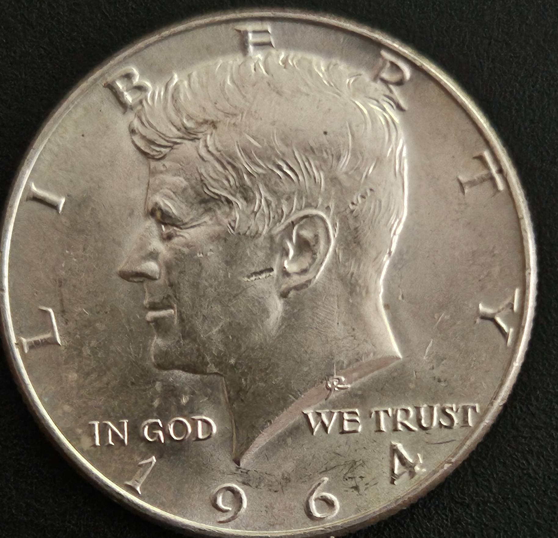 1964-Kennedy-Half-With-Three-Marks-Behind-Ear-And-One-Infront-Of-Ear