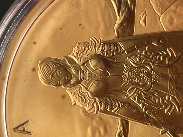 Red-Spotting-On-.999-Gold-Komsco-Round