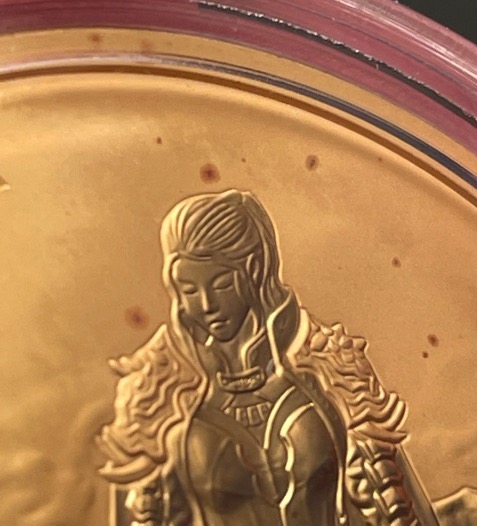 Red-Spotting-On-.999-Gold-Komsco-Round