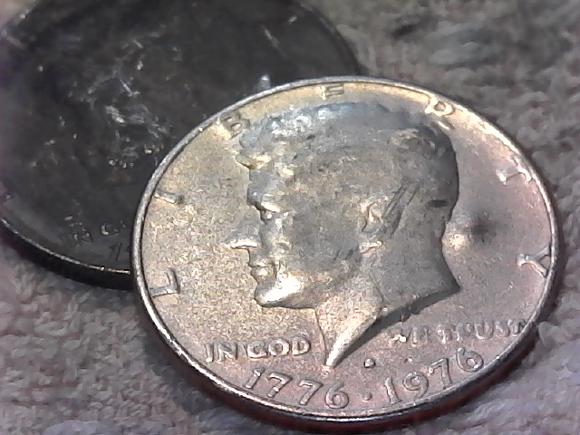 1776-1976-D-Kennedy-Half.--Large-Raised-Areas-On-Both-Sides?