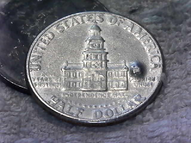 1776-1976-D-Kennedy-Half.--Large-Raised-Areas-On-Both-Sides?