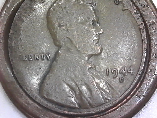 Three-Lincoln-Cents-Struck-Off-Center-And-One-?-Jewelry-Piece?
