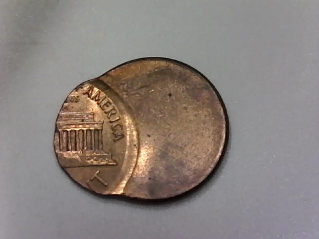 Three-Lincoln-Cents-Struck-Off-Center-And-One-?-Jewelry-Piece?