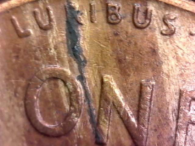 1955-S-LWC-Is-This-A-Lamination-Error,-Die-Crack-Or-Damage?-I-Can't-Tell.
