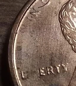 1994--Lincoln-Penny-With-Missing-Letters-On-Obverse