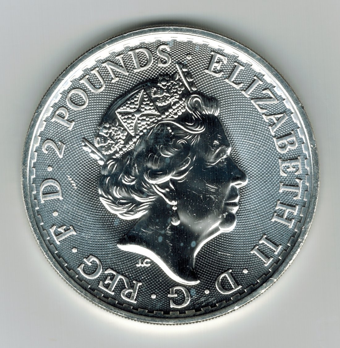 What-Are-These-Green/Blue-Spots-On-A-Silver-Coin?