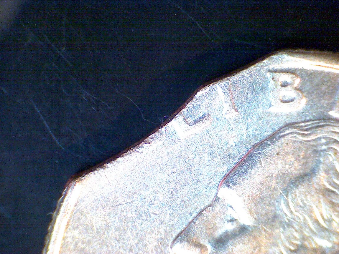 1996-Quarter,-Looks-Like-2-Curved-Clips-In-Same-Clip