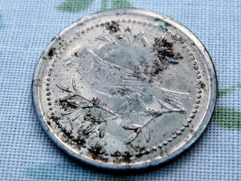 Please-Identify-This-Coin/Token-With-Value-Of-2-And-A-Songbird