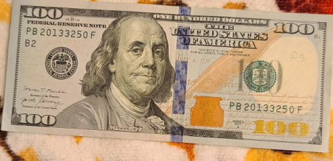 100-Dollar-Bills-With-Small-Ink-Stamps-On-The-Reverse