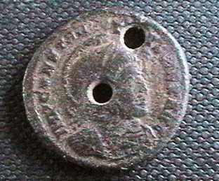 Holed-Coins-:-How-Much-Does-It-Lower-The-Value
