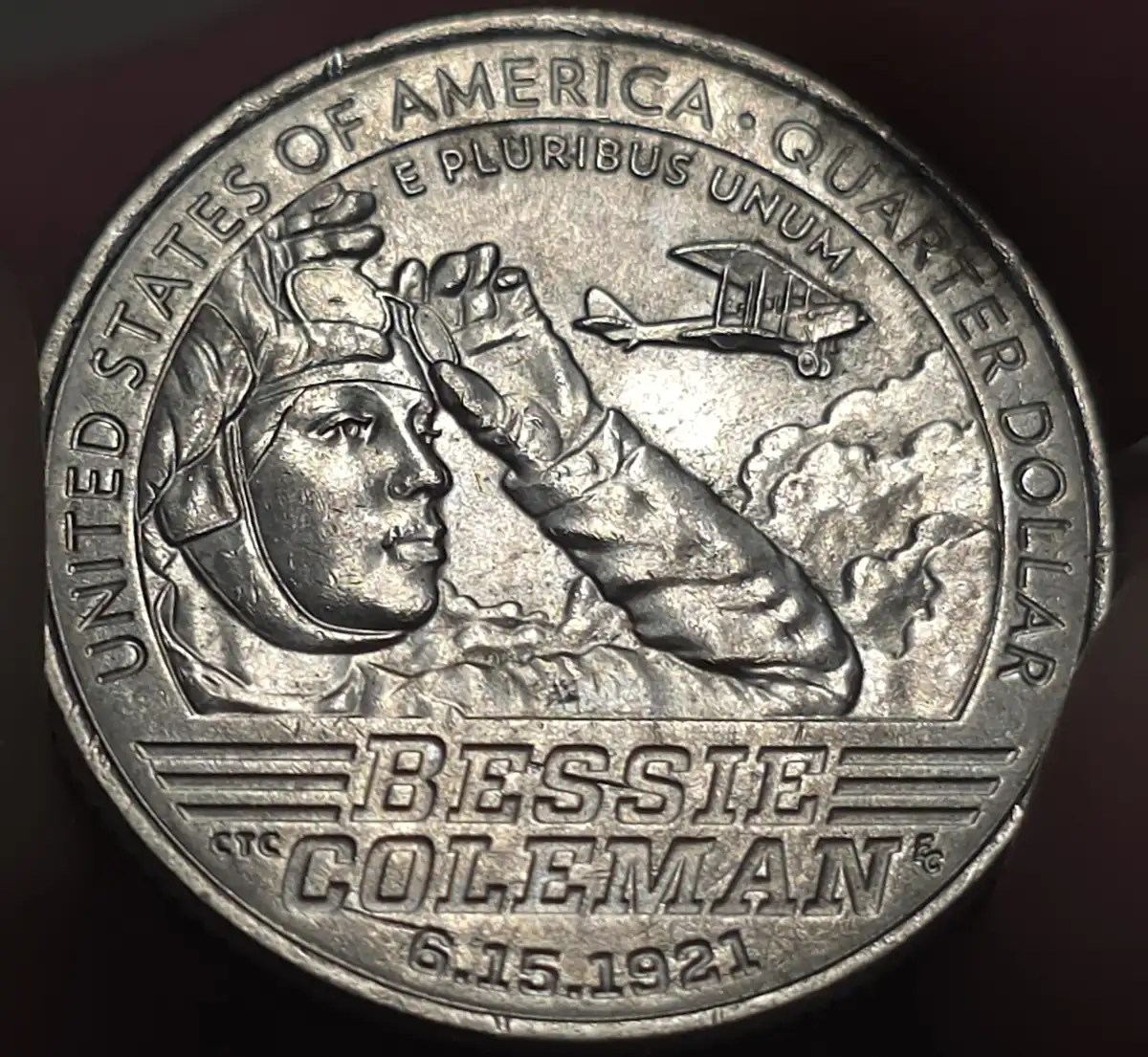 2023-Bessie-Coleman-Quarter-/What-Causes-These-Scratches-Behind-The-Design?