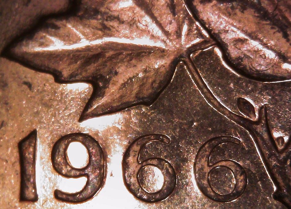 1966-Cent,-Odd-Circle-On-Leaf?