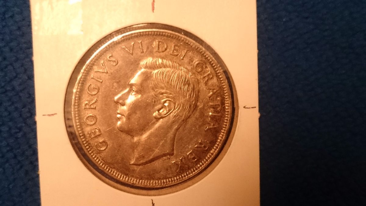 Grade-Of-This-Canada-1948-Silver-Dollar-With-Slight-Die-Rotation