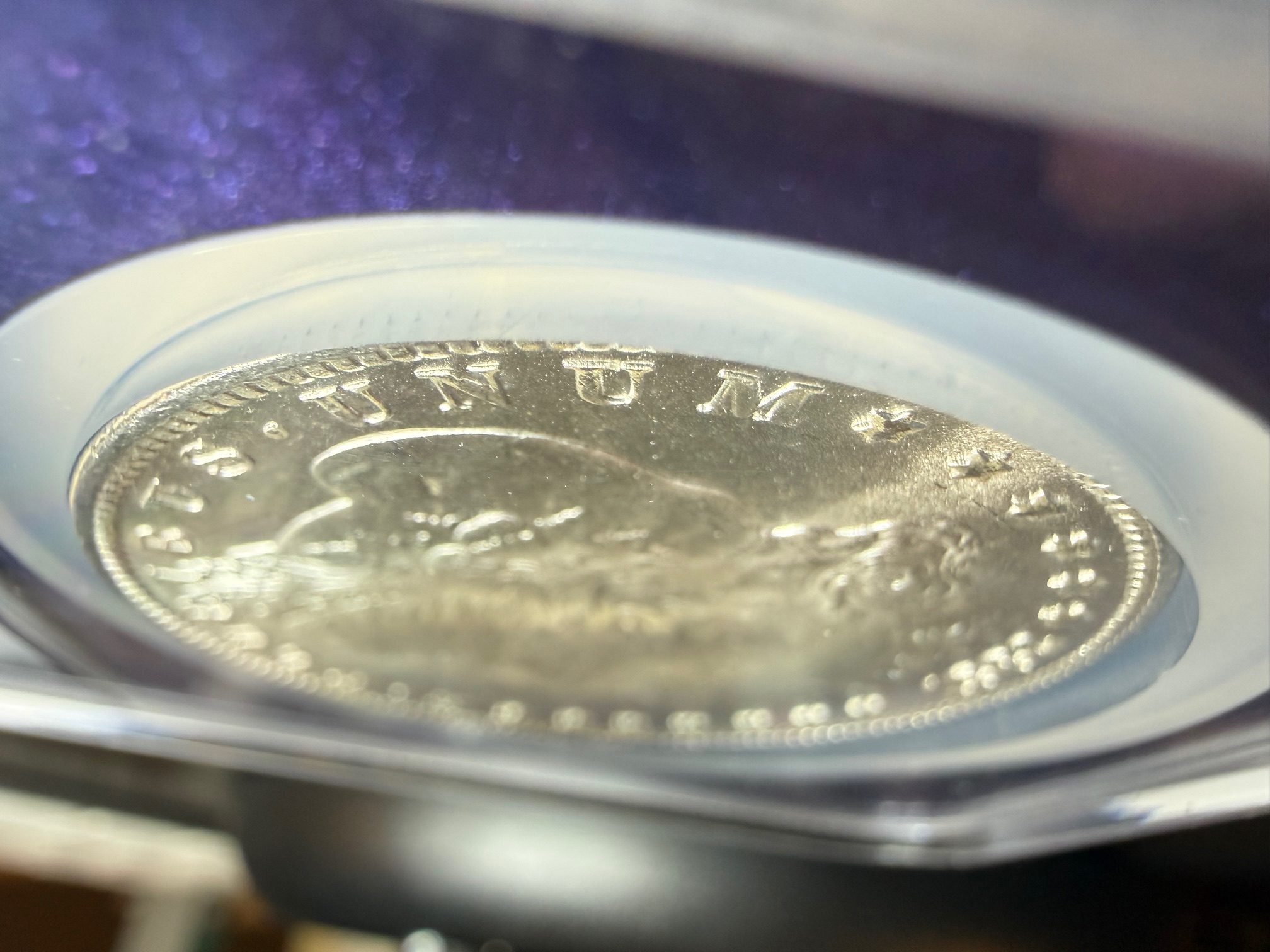 1882-CC-Morgan,-Slight-Tilt-&-Movement-In-NGC-Case