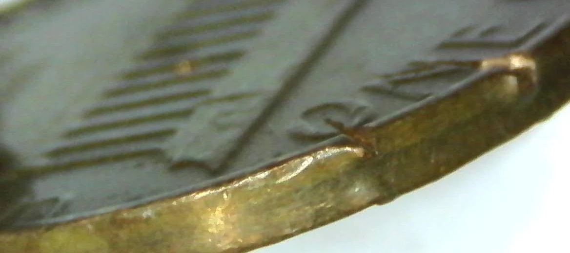 1982-Penny-Marks-On-Rim-And-Others-Damage?